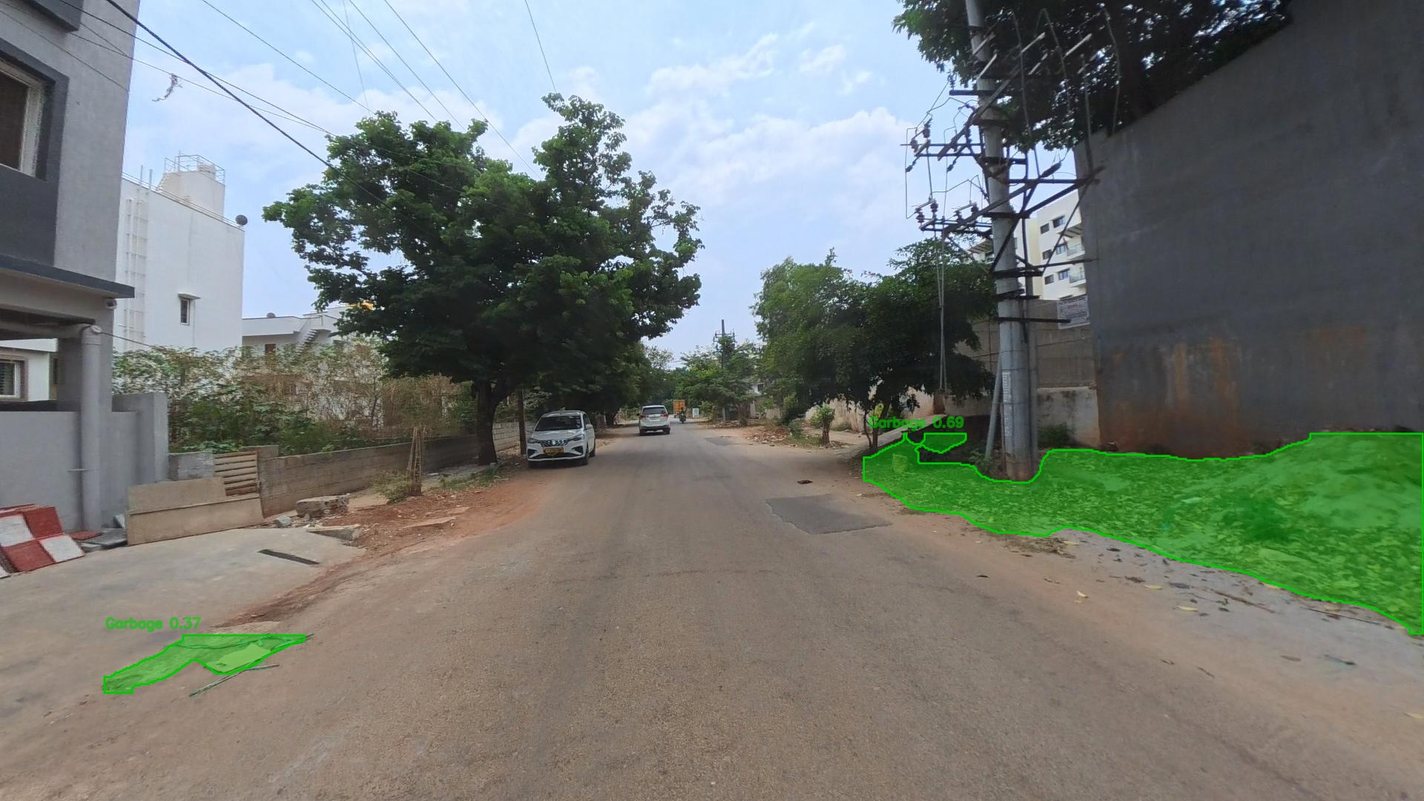 Garbage spread along the edge of a residential road, outlined in green